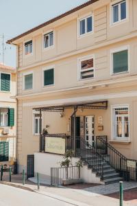 a building with a staircase in front of it at Apartments Liburnija in Opatija