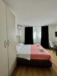Postel nebo postele na pokoji v ubytování Apartmani ROZA