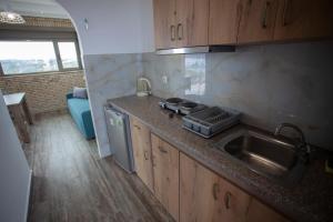 a kitchen with a sink and a counter top at Panorama Studios in Kefalos