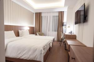Hotel Freya客房内的一张或多张床位