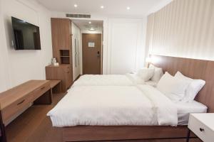 Hotel Freya客房内的一张或多张床位
