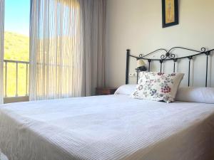 Postel nebo postele na pokoji v ubytování Hotel Al-Andalus