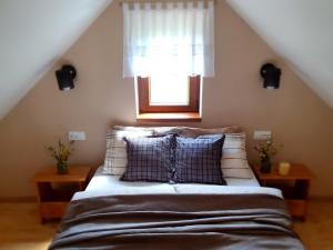 Postel nebo postele na pokoji v ubytování Domek Mały Czar