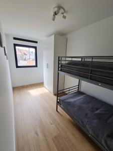 Vakantiehuis Mariakerke tesisinde bir ranza yatağı veya ranza yatakları