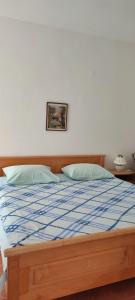 Postel nebo postele na pokoji v ubytování Apartments Josko Barbat