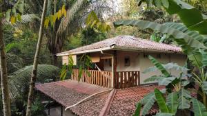 a small house in the middle of a forest at Colibri Apartments - Private kitchen & bathroom - 4 min walk to the Beach! in Santa Teresa Beach