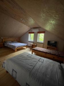 Postel nebo postele na pokoji v ubytování Pulkvedis Guest House