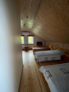 Postel nebo postele na pokoji v ubytování Pulkvedis Guest House