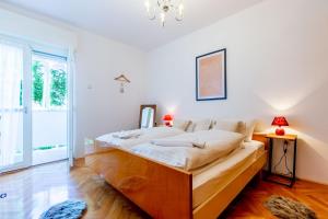 Posteľ alebo postele v izbe v ubytovaní Marinero Apartment