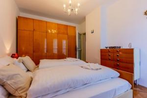 Postel nebo postele na pokoji v ubytování Marinero Apartment