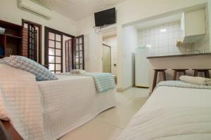 Cama ou camas em um quarto em Apart Hotel Porto Kanoas