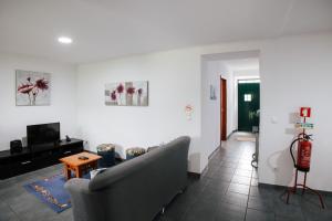 TV a/nebo společenská místnost v ubytování Casa das Palmeiras