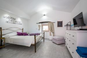 Postel nebo postele na pokoji v ubytování Casa Mirto