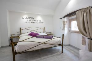 Postel nebo postele na pokoji v ubytování Casa Mirto