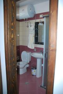 a bathroom with a toilet and a sink at Hotel Klea in Berat