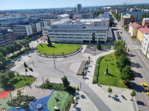 an aerial view of a city with a building at Penthouse in the Oulu center in Oulu