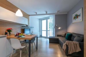 Posezení v ubytování Apartament Muszelka Jantar TriApart + 19 fotografií