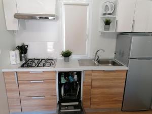 Kuchyňa alebo kuchynka v ubytovaní SweetHome
