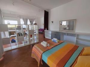 a bedroom with a large bed in a room at Oneiro glico in Agia Marina Aegina