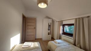Posteľ alebo postele v izbe v ubytovaní Apartamenty Starowiejska 39, Ryczów - 10km od Zator Energylandia
