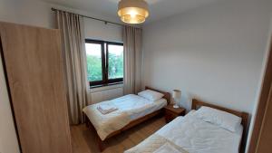 Posteľ alebo postele v izbe v ubytovaní Apartamenty Starowiejska 39, Ryczów - 10km od Zator Energylandia