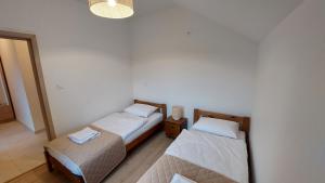 Posteľ alebo postele v izbe v ubytovaní Apartamenty Starowiejska 39, Ryczów - 10km od Zator Energylandia