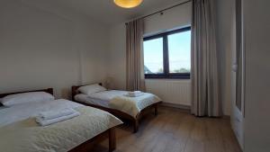 Posteľ alebo postele v izbe v ubytovaní Apartamenty Starowiejska 39, Ryczów - 10km od Zator Energylandia