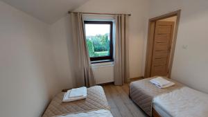 Posteľ alebo postele v izbe v ubytovaní Apartamenty Starowiejska 39, Ryczów - 10km od Zator Energylandia