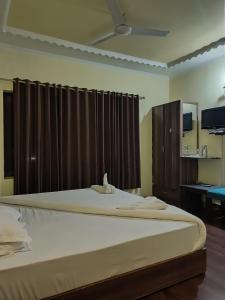 Katil atau katil-katil dalam bilik di Hotel curio's All seasons