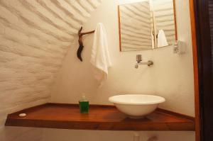 a bathroom with a sink and a toilet on a wooden counter at Casa B&B in Jijoca de Jericoacoara +78 photos