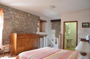 A bed or beds in a room at Agriturismo Podere Fiume