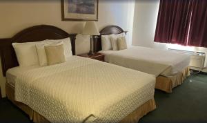 Ліжко або ліжка в номері Scipio Hotel