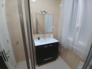 a bathroom with a sink and a mirror at A casa de Xues in Pontevedra +20 photos