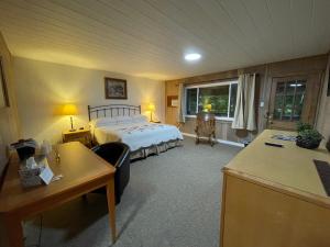 Ένα ή περισσότερα κρεβάτια σε δωμάτιο στο New Hope Lodge
