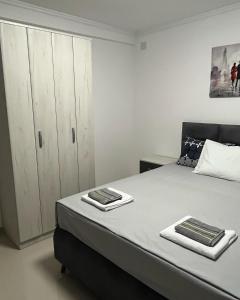 A bed or beds in a room at Apartments MASIMO