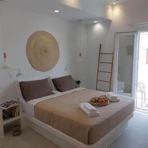 Ein Bett oder Betten in einem Zimmer der Unterkunft Elite Suites Naxos