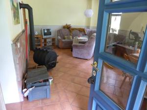 a living room with a couch and a mirror at Senfmühle Lubast in Lubast