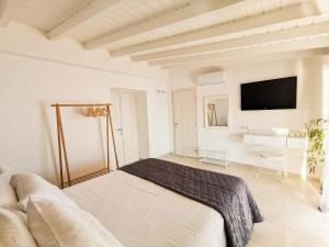 A bed or beds in a room at Evgenia Seafront House