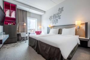 Rúm í herbergi á Radisson Blu Hotel Uppsala