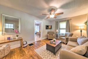 a living room with a couch and a ceiling fan at Lucky Dawg Pet-Friendly Abode Near St Louis! in Pacific