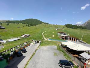 a parking lot with cars parked on the side of a road at Loft Mountain Spirit in Livigno
