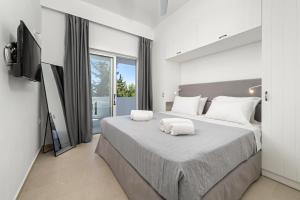 Postel nebo postele na pokoji v ubytování Playia Villas II