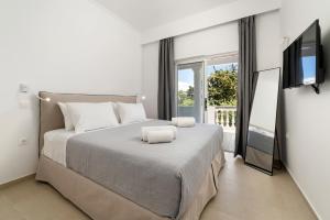 Postel nebo postele na pokoji v ubytování Playia Villas II + 18 fotografií