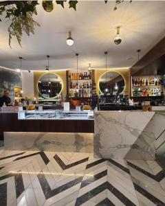 a bar with marble counter tops in a restaurant at B&B Villa Filù in Portici
