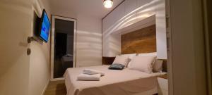 Posteľ alebo postele v izbe v ubytovaní Apartman Marčelina 2 in Trogir