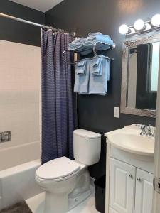 a bathroom with a toilet and a sink at Golden Gate Park Sweet Home- 3 Bedrooms in San Francisco