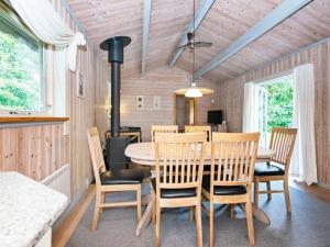 a dining room with a table and chairs at 6 person holiday home in Silkeborg in Silkeborg