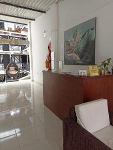 a lobby with a reception desk in a building at Hotel SAMAI in San Agustín