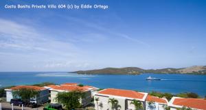 a view of a body of water with houses and a boat at Costa Bonita Private Villa 604 in Culebra