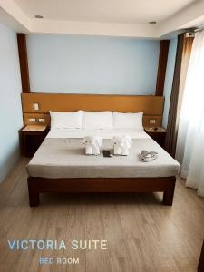 Tempat tidur dalam kamar di Hotel Mercante